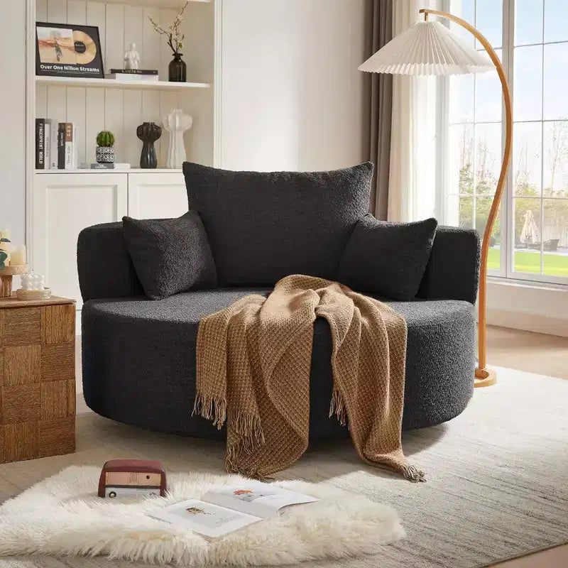Poltrona rotonda girevole per 3 persone nei colori beige, nero, grigio e verde