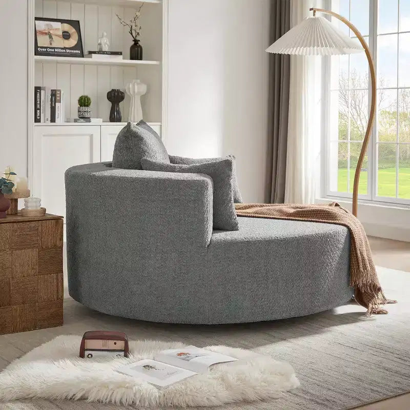 Poltrona rotonda girevole per 3 persone nei colori beige, nero, grigio e verde