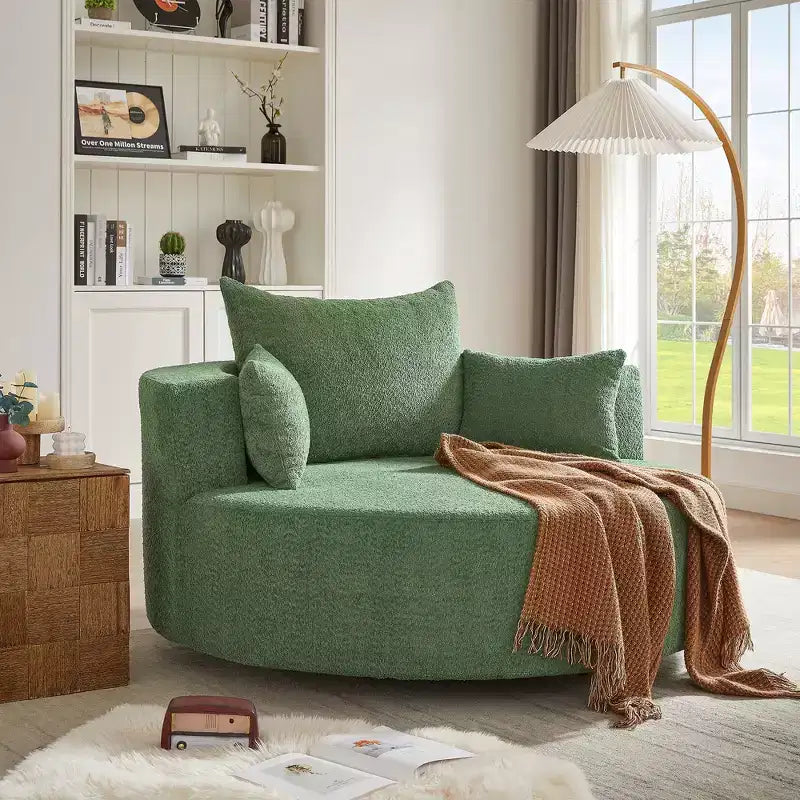 Poltrona rotonda girevole per 3 persone nei colori beige, nero, grigio e verde