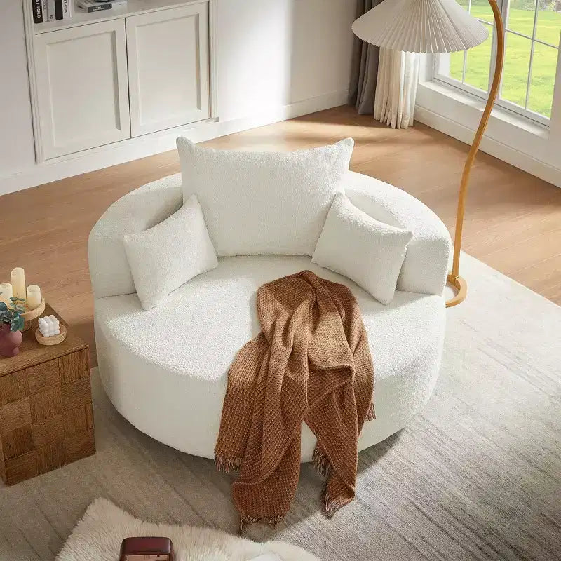Poltrona rotonda girevole per 3 persone nei colori beige, nero, grigio e verde