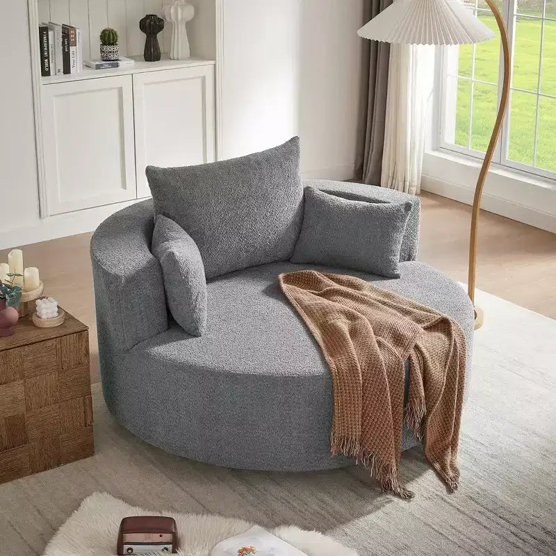 Poltrona rotonda girevole per 3 persone nei colori beige, nero, grigio e verde
