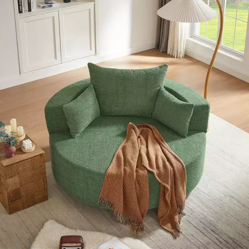 Poltrona rotonda girevole per 3 persone nei colori beige, nero, grigio e verde